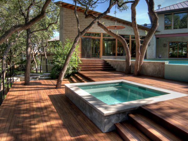 Merbau deck with spa integration built to preserve existing trees. Custom built Merbau spa deck integrating existing mature trees